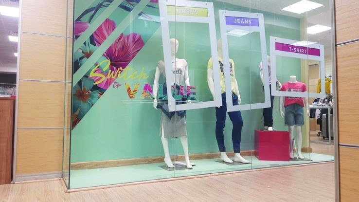 Printed window branding graphics on a storefront